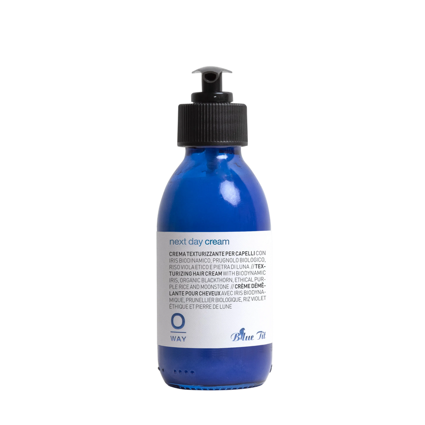Blue bottle with pump on a white background